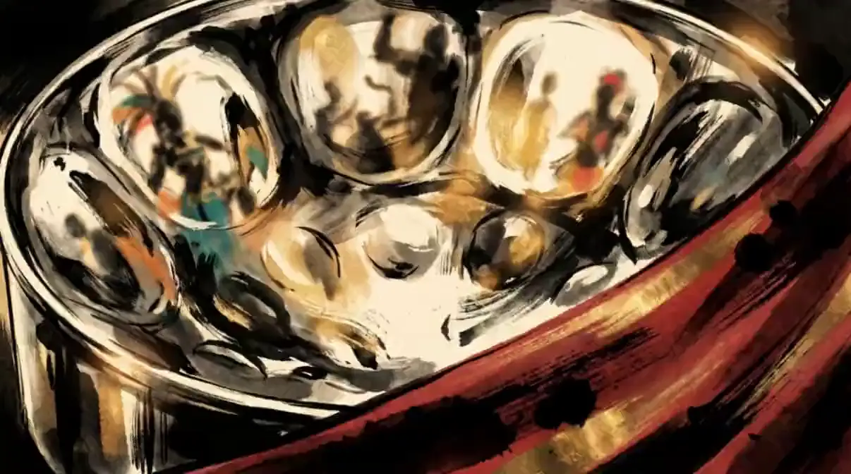 Close-up of a chrome steelpan drum with folds of red silk sweeping across it
